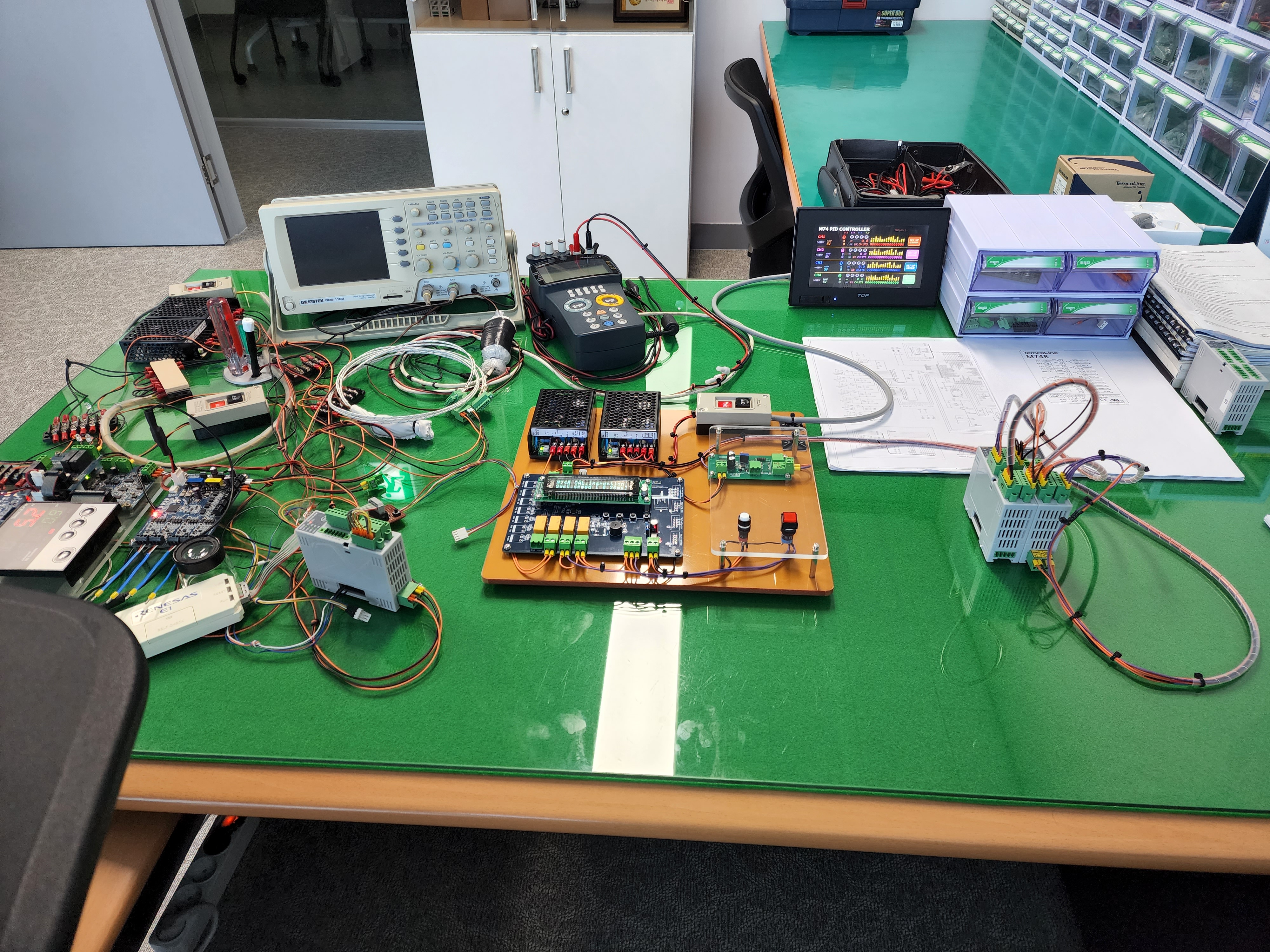 Oscilloscopes and control-circuit development and testing workbench at TemcoLine's Seoul headquarters